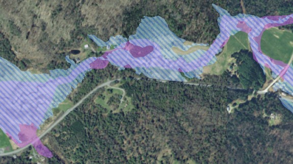 A map with layers showing the old and new zone A areas over a landscape.